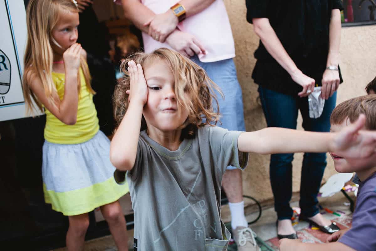 Kid dancing at a birthday party.