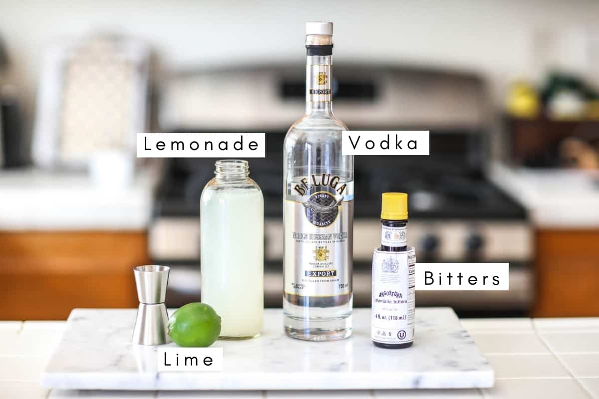 Labeled ingredients to make a Long Vodka Cocktail on a counter. 