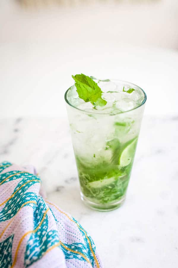 Vodka mojito on a table with a napkin.