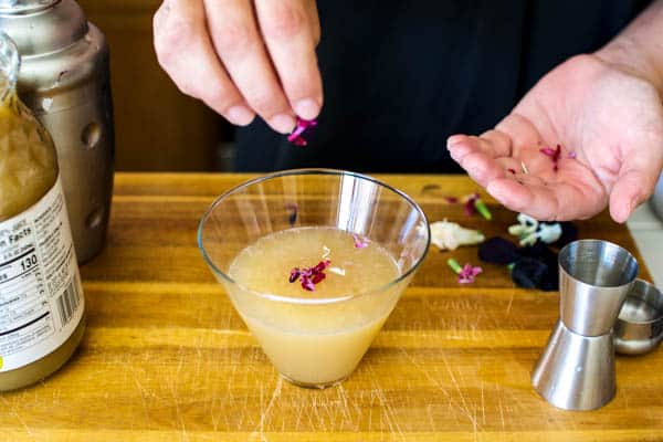 Adding flowers to a pear vodka cocktail idea.