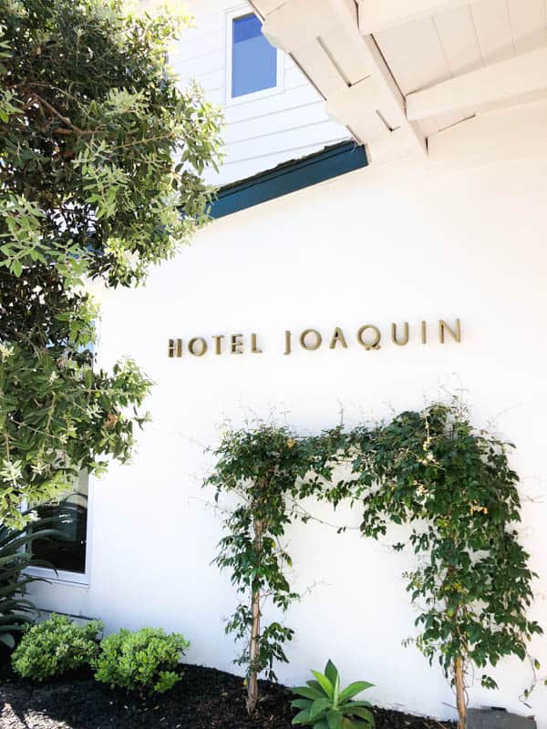 Hotel Joaquin sign on the front wall of my favorite boutique hotel in Laguna Beach.
