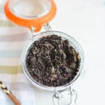 Close up of a jar holding a DIY coffee scrub.