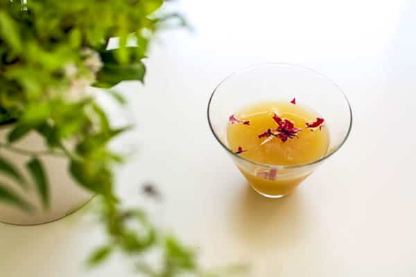How to make a pear martini with edible flower drink confetti.