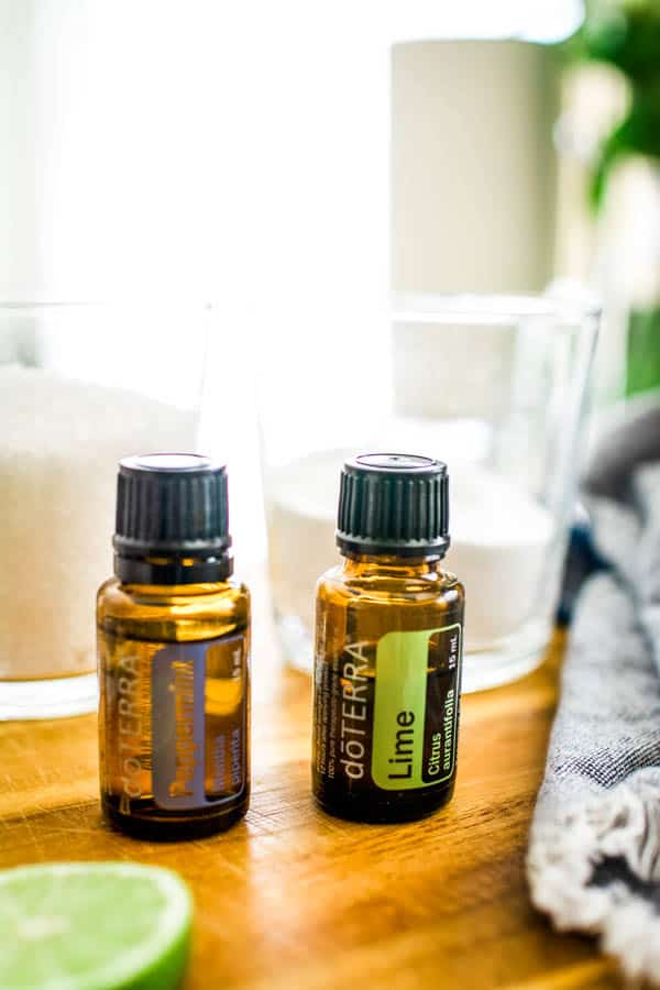 Bottles of lime and peppermint essential oil. 