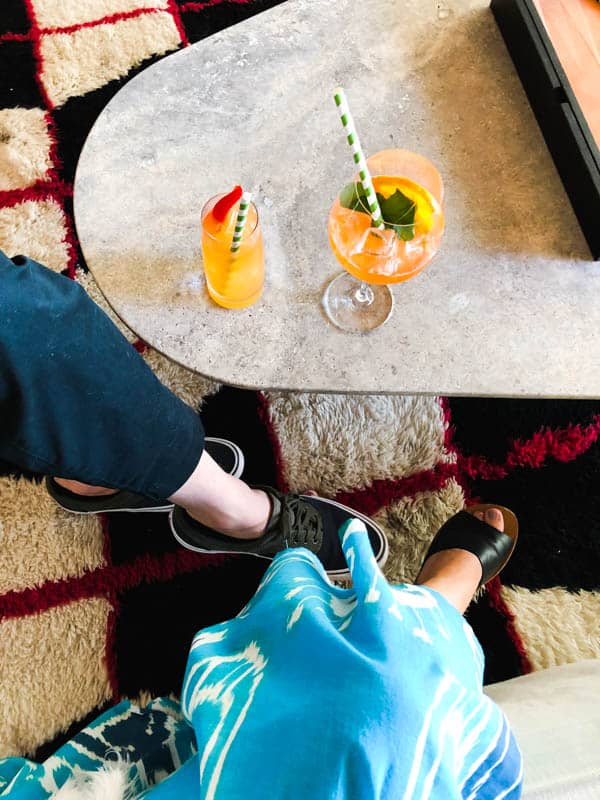 Cocktails on a marble table in the living room at Hotel Joaquin in Laguna Beach.