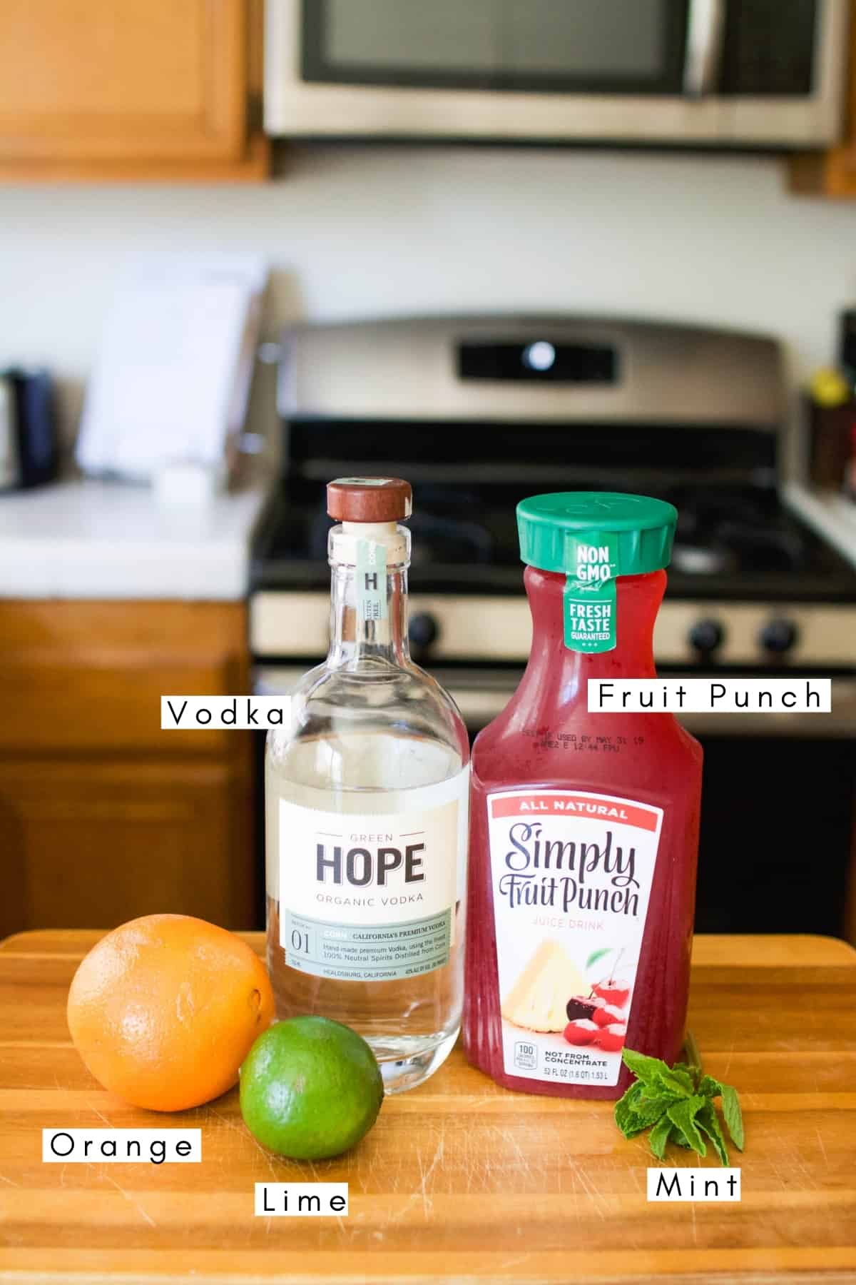 Labeled ingredients to make a Fruity Drink with Vodka.