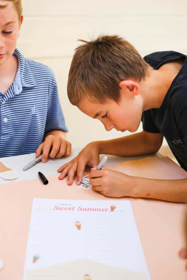 kid writing on a piece of paper