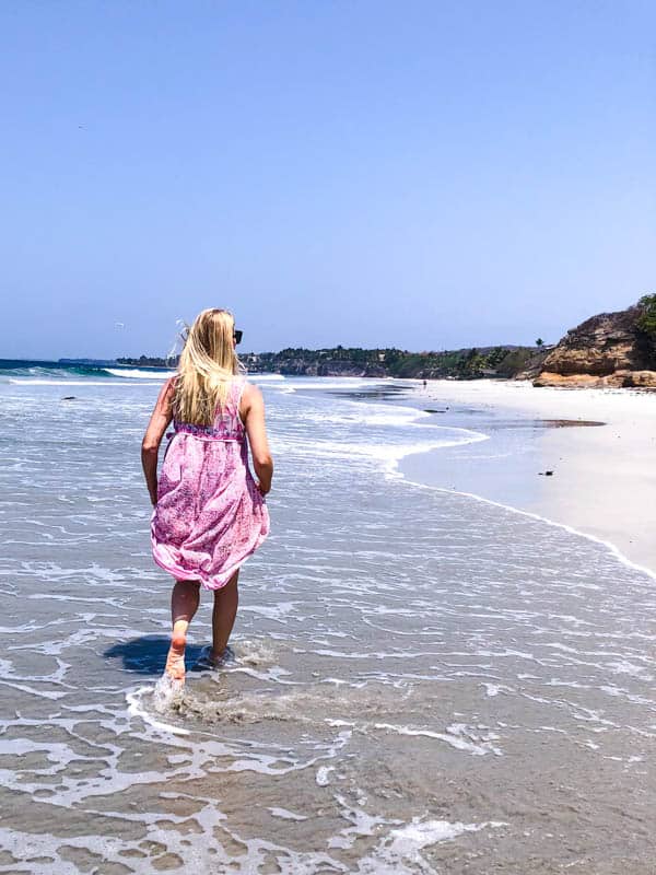 Walking in the surf at the Marival Armony resort in Mexico.