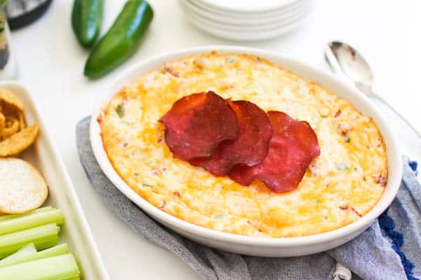 Baked Jalapeno Dip with Cream Cheese and Dried Beef on a table.