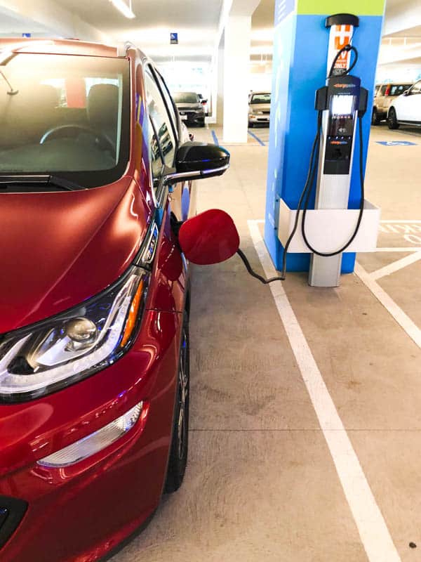 Charging a red Chevy Bolt.