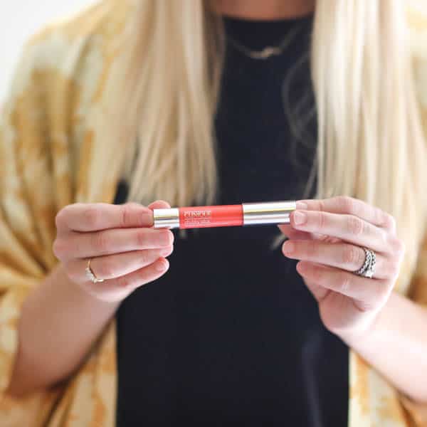 girl holding a Clinique chubby stick