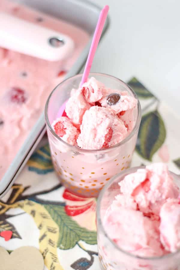 a cup full of easy homemade strawberry ice cream with M&Ms