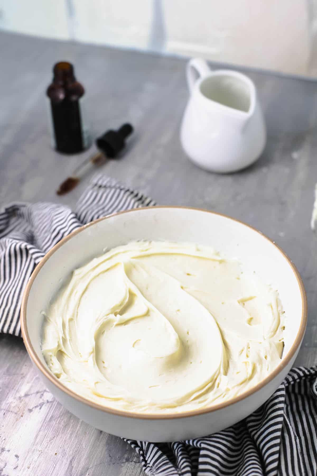 A bowl on the counter with classic vanilla buttercream.