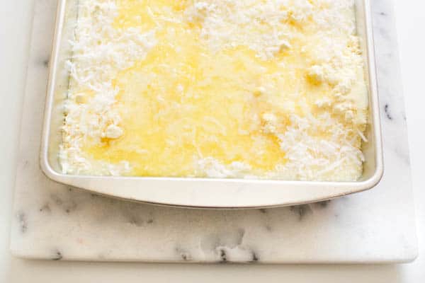 pineapple dump cake with yellow cake mix and melted butter