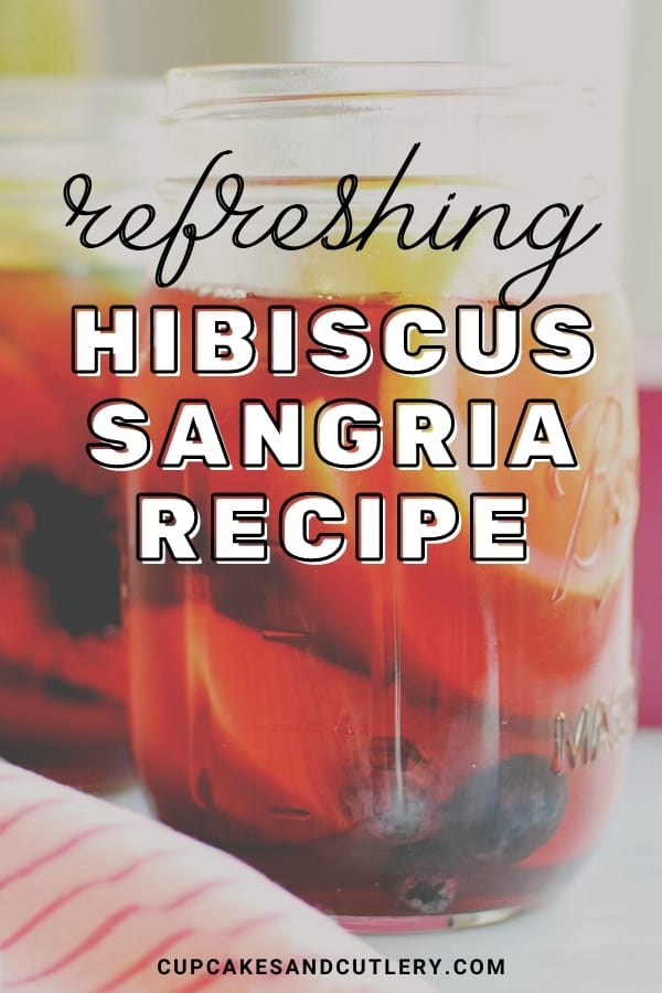 Close up of Hibiscus Sangria in a jar with text overlay.