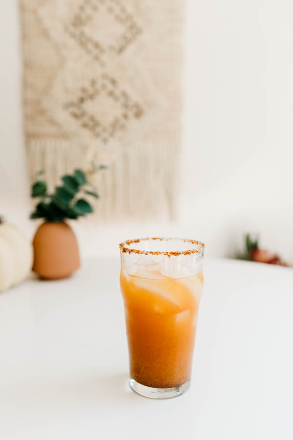 Fall michelada with pumpkin on a table. 