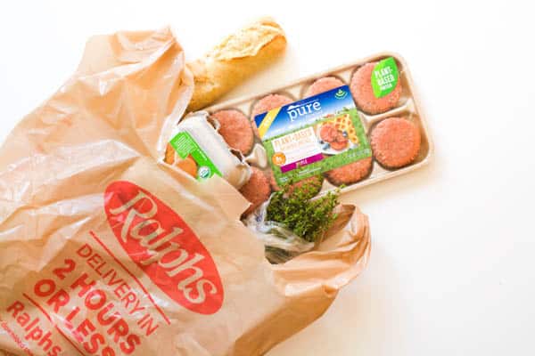 A Ralphs grocery bag with Veggie sausage package sticking out