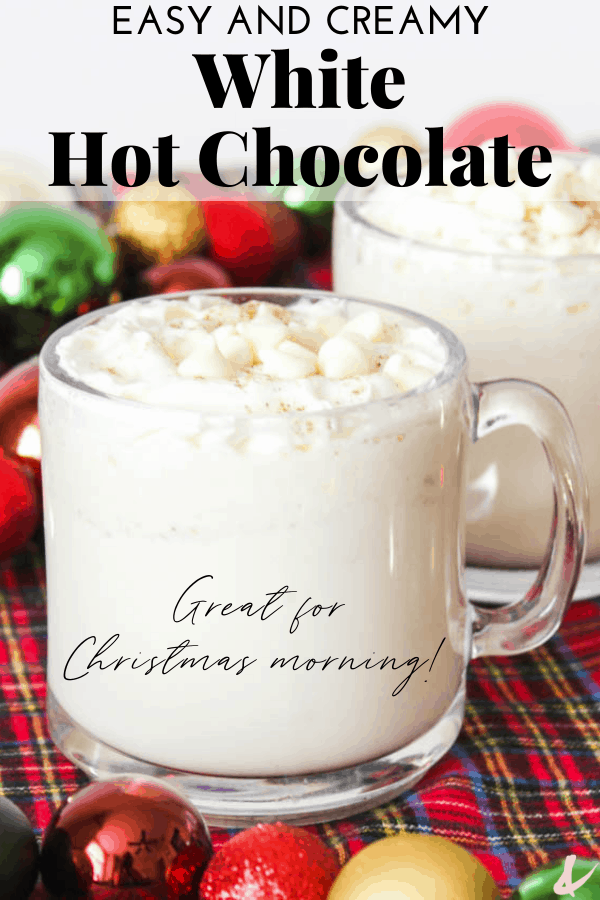mugs of white hot chocolate recipe on a table with christmas decorations