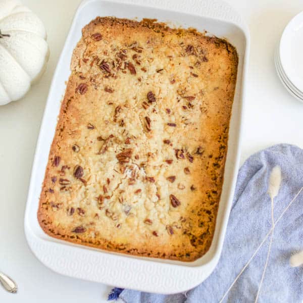 A baking pan with a pumpkin dump cake recipe in it. 