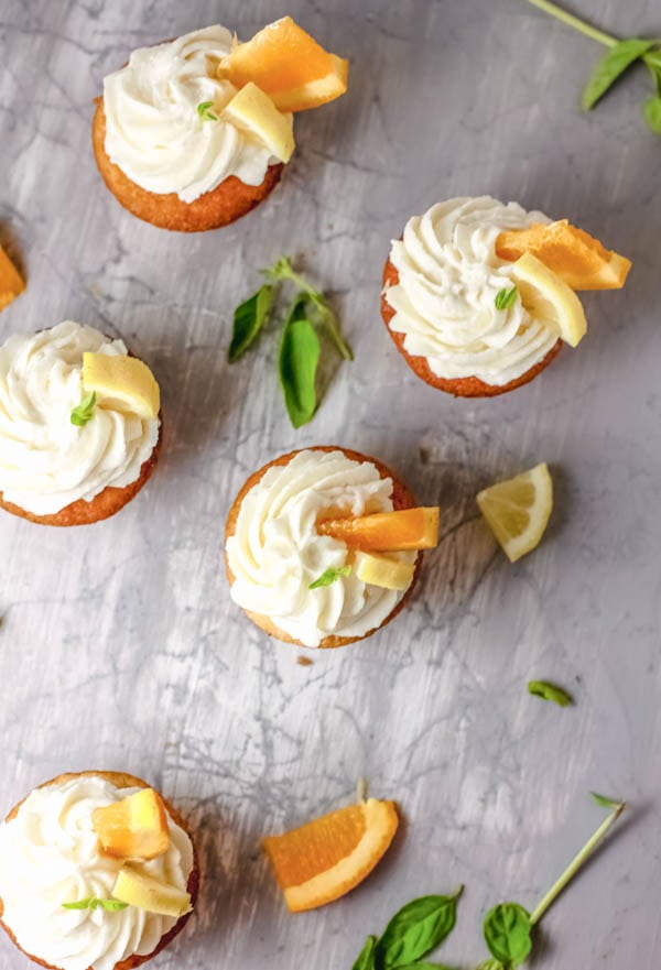 Easy sangria cupcakes frosted and garnished on a table.