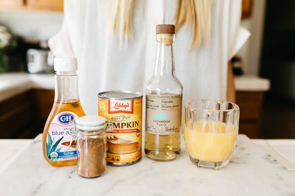 Ingredients for a pumpkin spice margarita on a counter. 