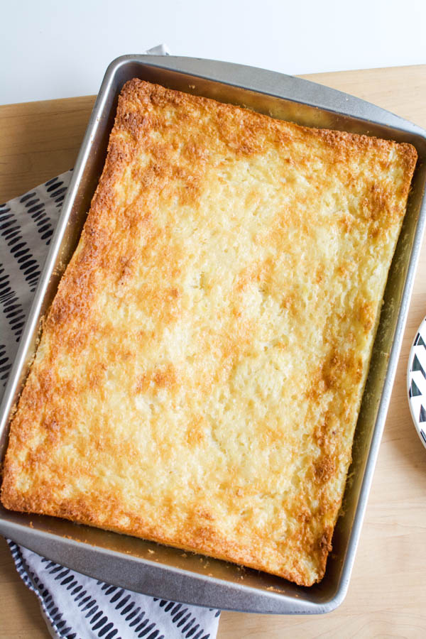 Easy angel food pineapple dump cake in a pan on a table.