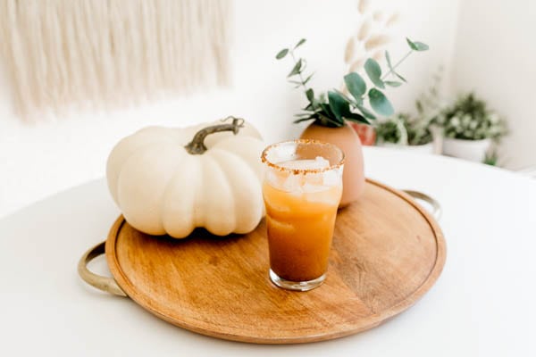 Pumpkin beer cocktail on a table.