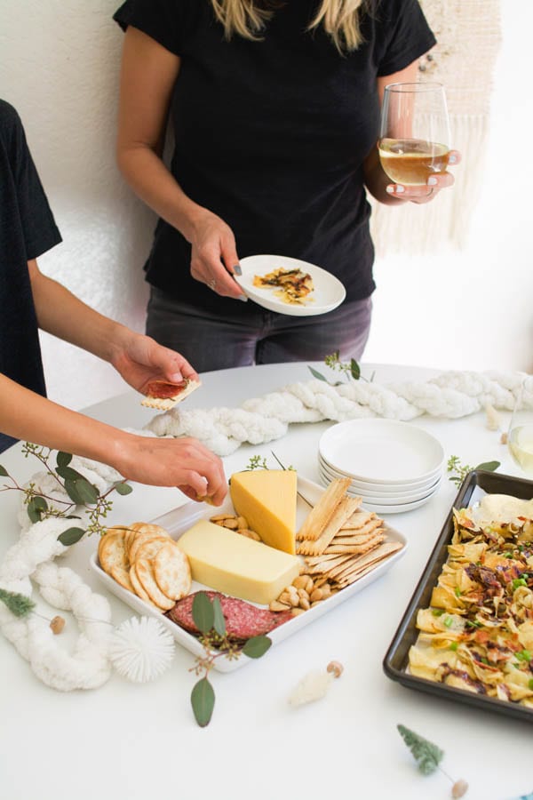 Cheese tray and blue cheese potato chip nachos on a party table. 