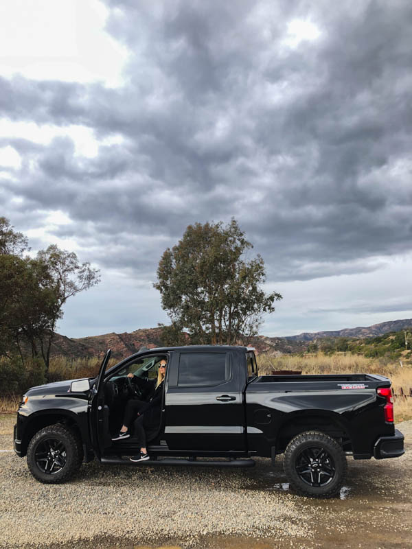 Woman driving Chevrolet Silverado.