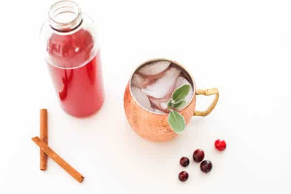 Christmas Moscow Mule with spiced cranberry juice on a table
