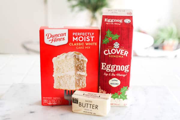 Ingredients for eggnog dump cake on a table.
