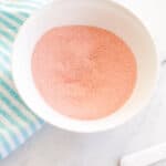 Close up of a white bowl holding homemade Fun Dip candy.