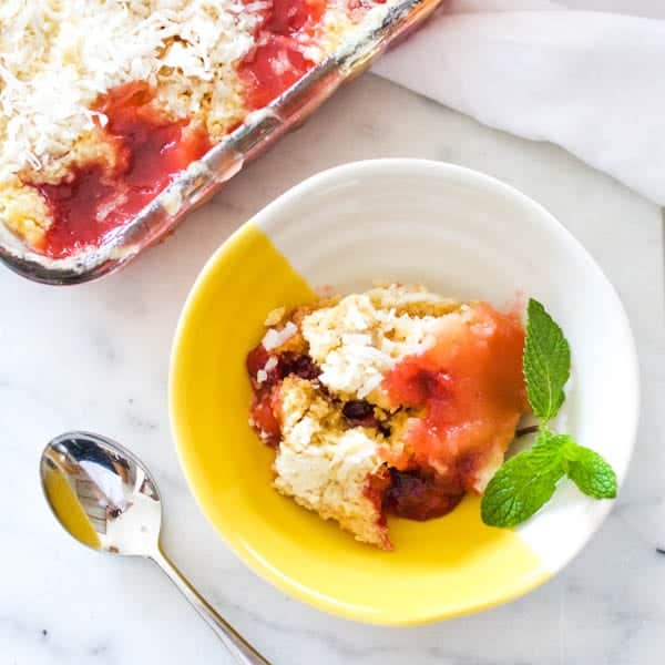 Microwave dump cake in a serving dish on a counter.