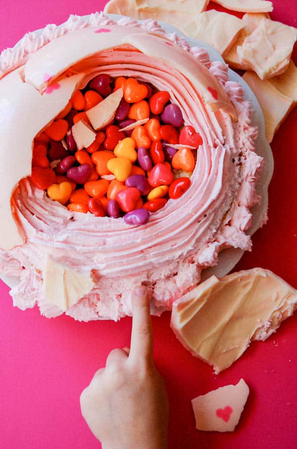 kids can't resist touching this easy pinata cake that is covered with a hard white chocolate dome and filled with candies.