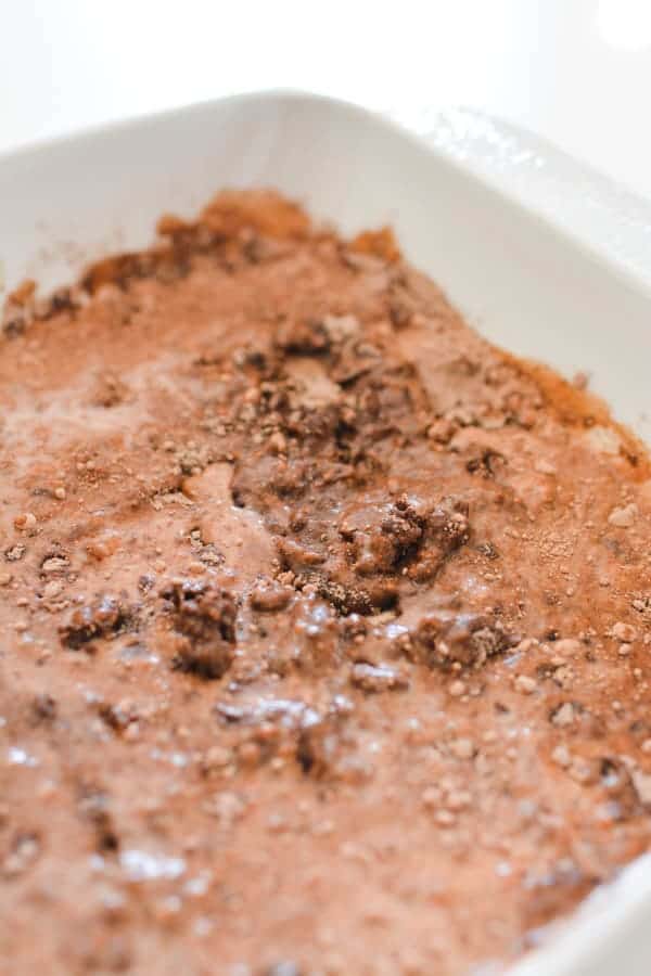  Baking dish with dry chocolate cake mix and milk.