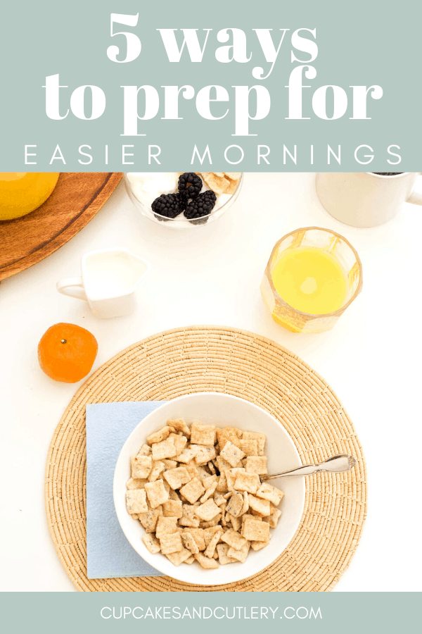 Cereal in a bowl on a table with orange juice with text overlay for Pinterest.