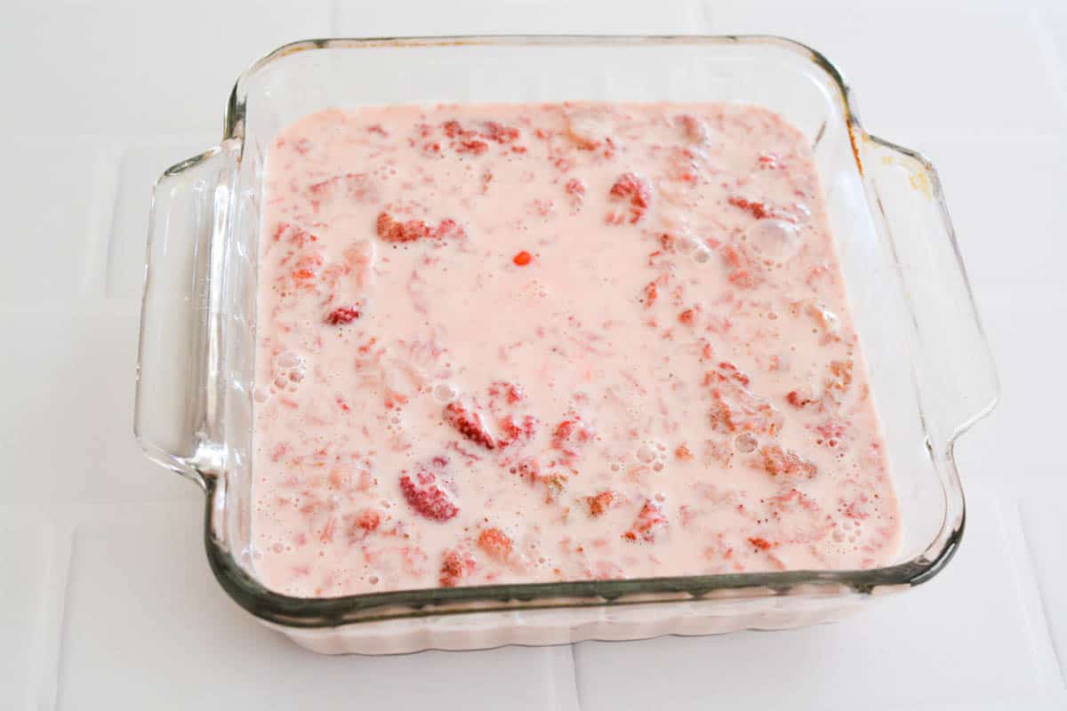 A pan with a strawberry dessert on a counter.