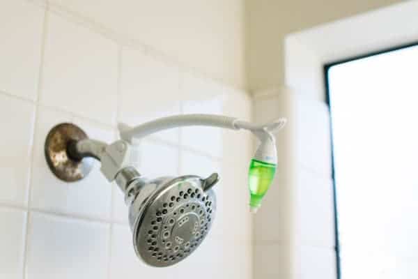 Shower head with an essential oil diffuser attached.