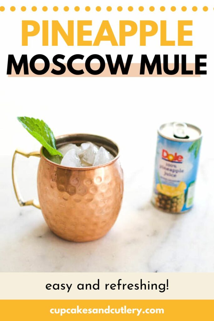 Copper mug garnished with ice and mint next to a can of pineapple juice.