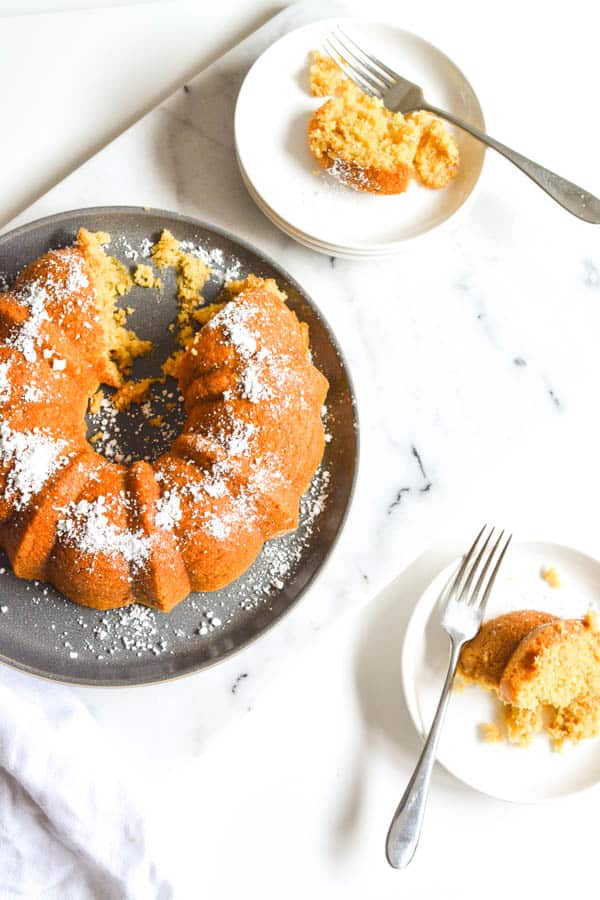 cake made with cake mix and a can of soda on a plate with slices on dessert plates next to it