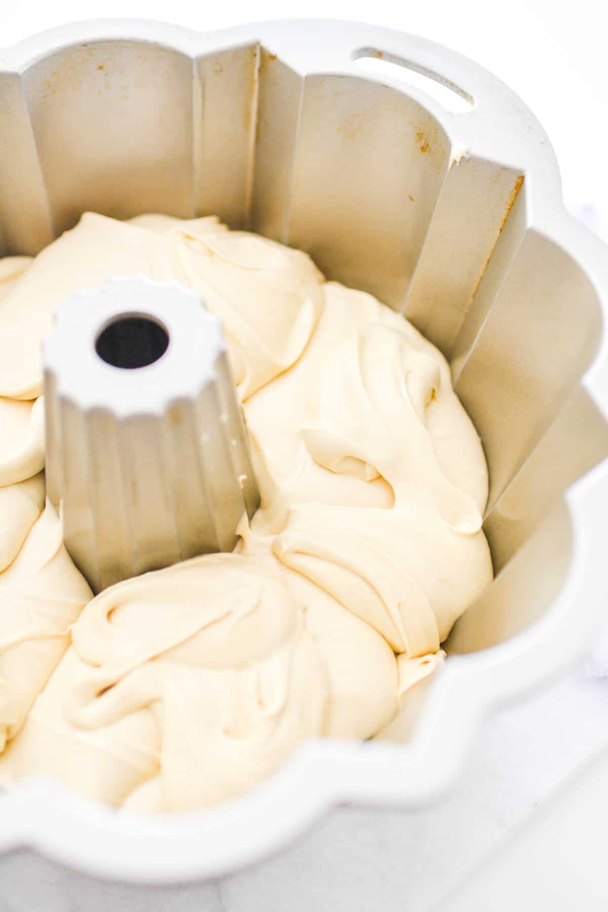 Bundt pan full of cake batter before being baked.