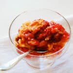 A close up of a serving of cherry dump cake.