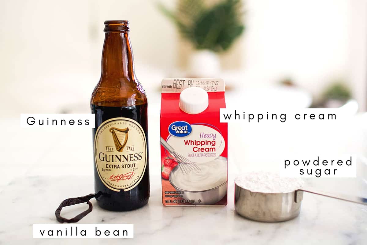 Labeled ingredients for making beer whipped cream on a counter.