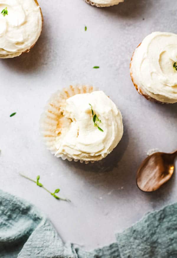 Cupcakes infused with St. Germain Elderflower liqueur on a table.