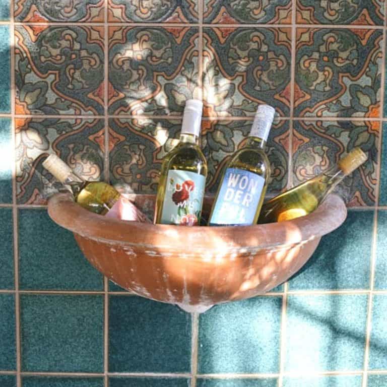Wine bottles from Winc wine club in a fountain bowl.