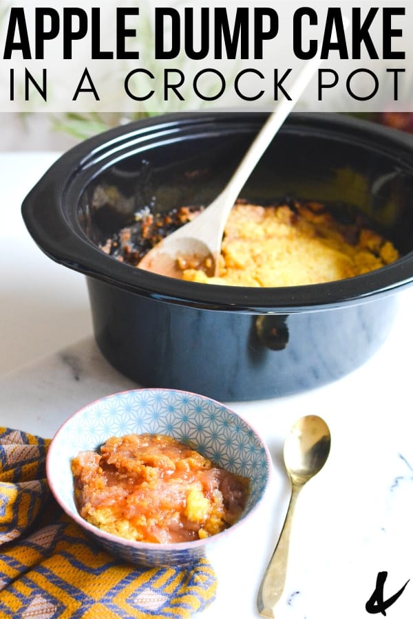 portion of apple dump cake in a bowl sitting in front of a slow cooker