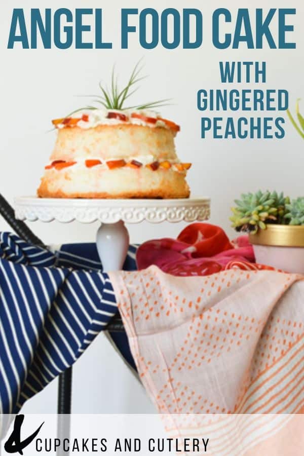 Layered angel food cake with peaches and whipped cream on a cake stand on a table with text overlay.