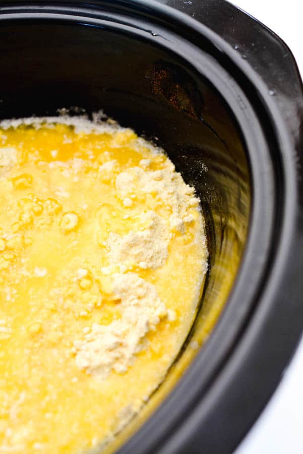 melted butter over apple pie filling and dry cake mix in a slow cooker