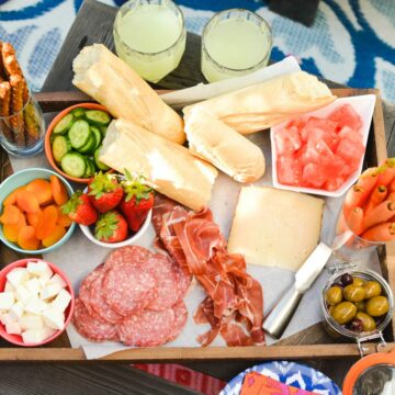 Close up of snack foods and fruit on a tray for a family to enjoy.