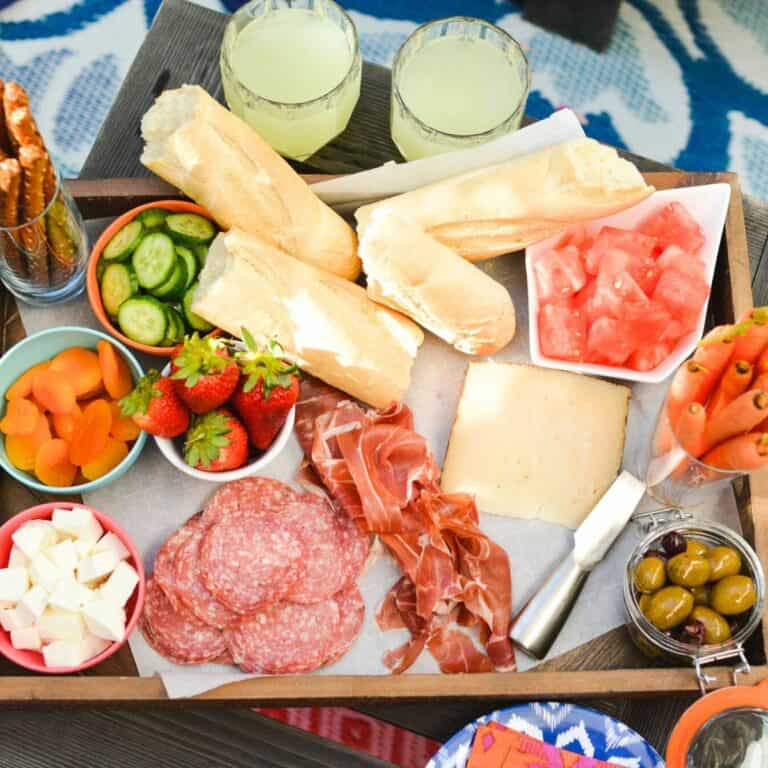 Close up of snack foods and fruit on a tray for a family to enjoy.